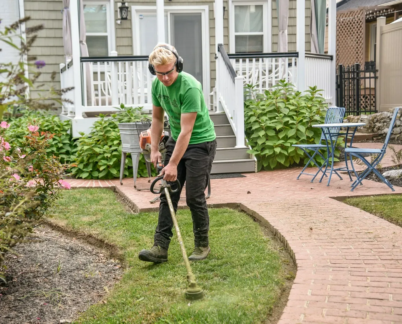 An S.T.S.B gardener edging a lawn
